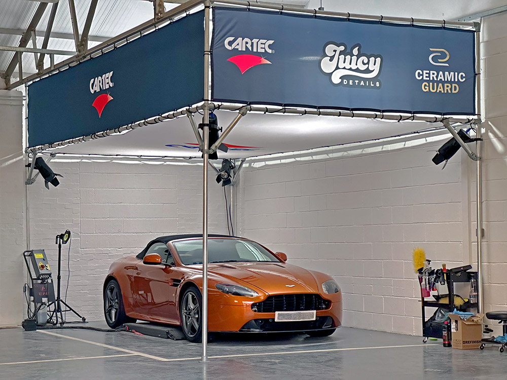 Aston Martin Vantage S in for a ceramic coating in the Juicy Car Care unit - Burgess Hill